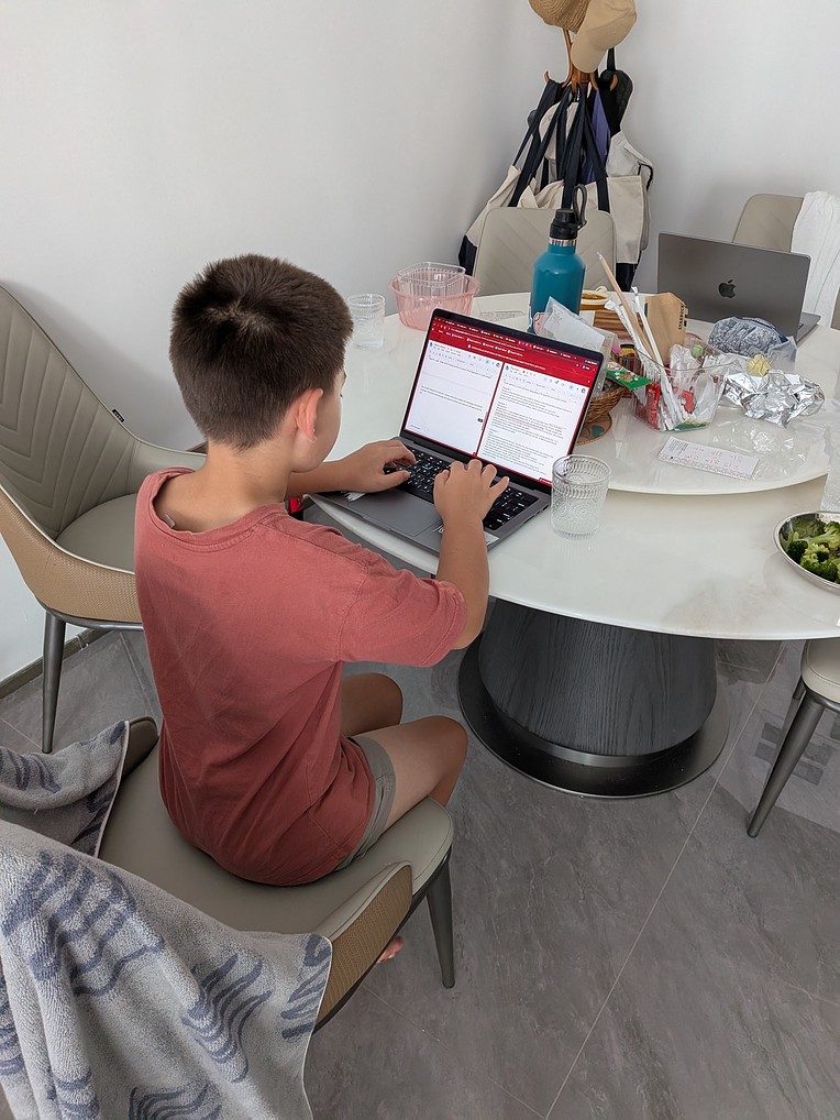 Nikolai working on his report